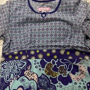 Koi Kathy Peterson Scrub Top Purple and Blue
size M fits like a Small EUC
